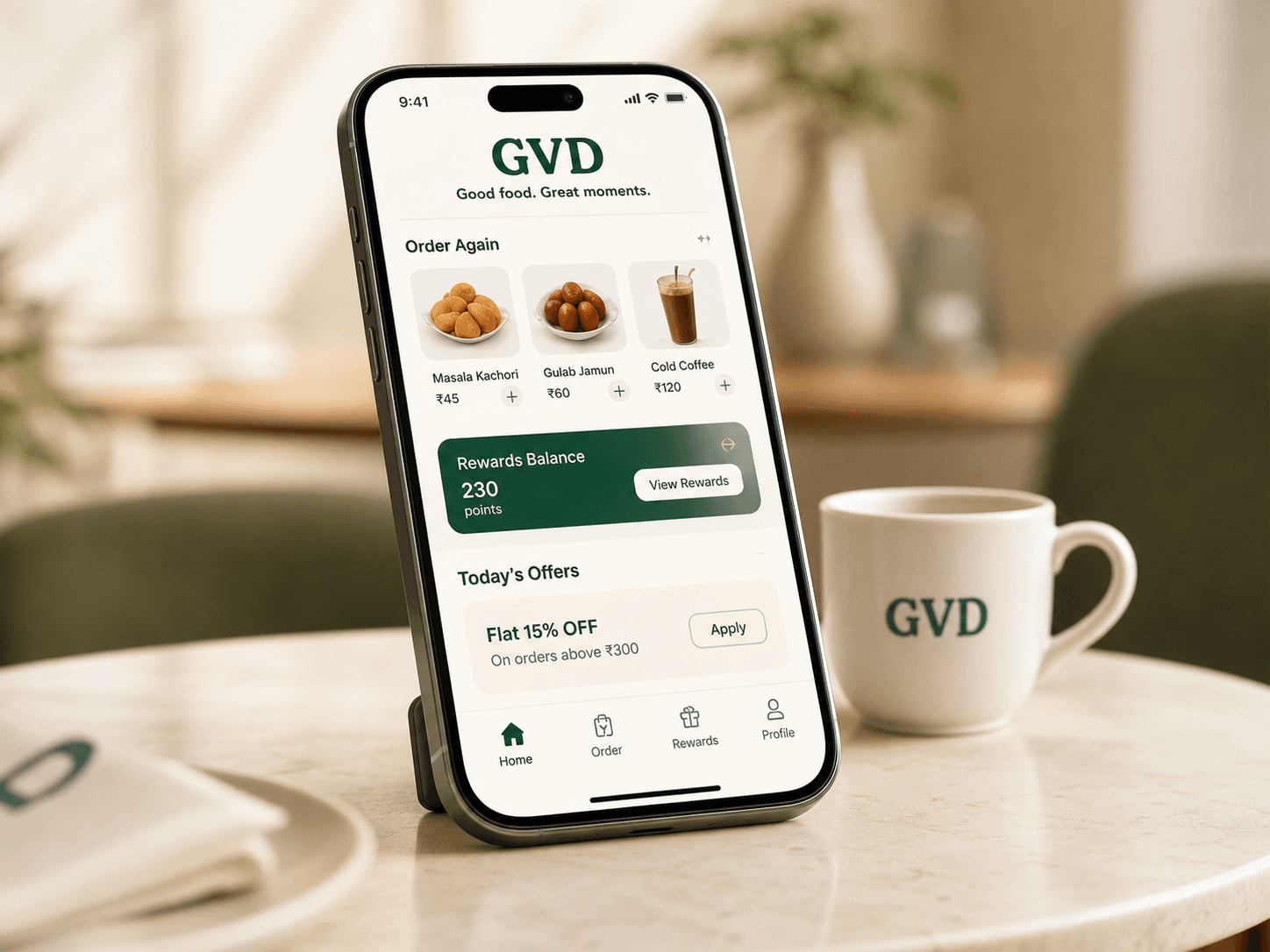 GVD food ordering app displayed on a smartphone in a cafe